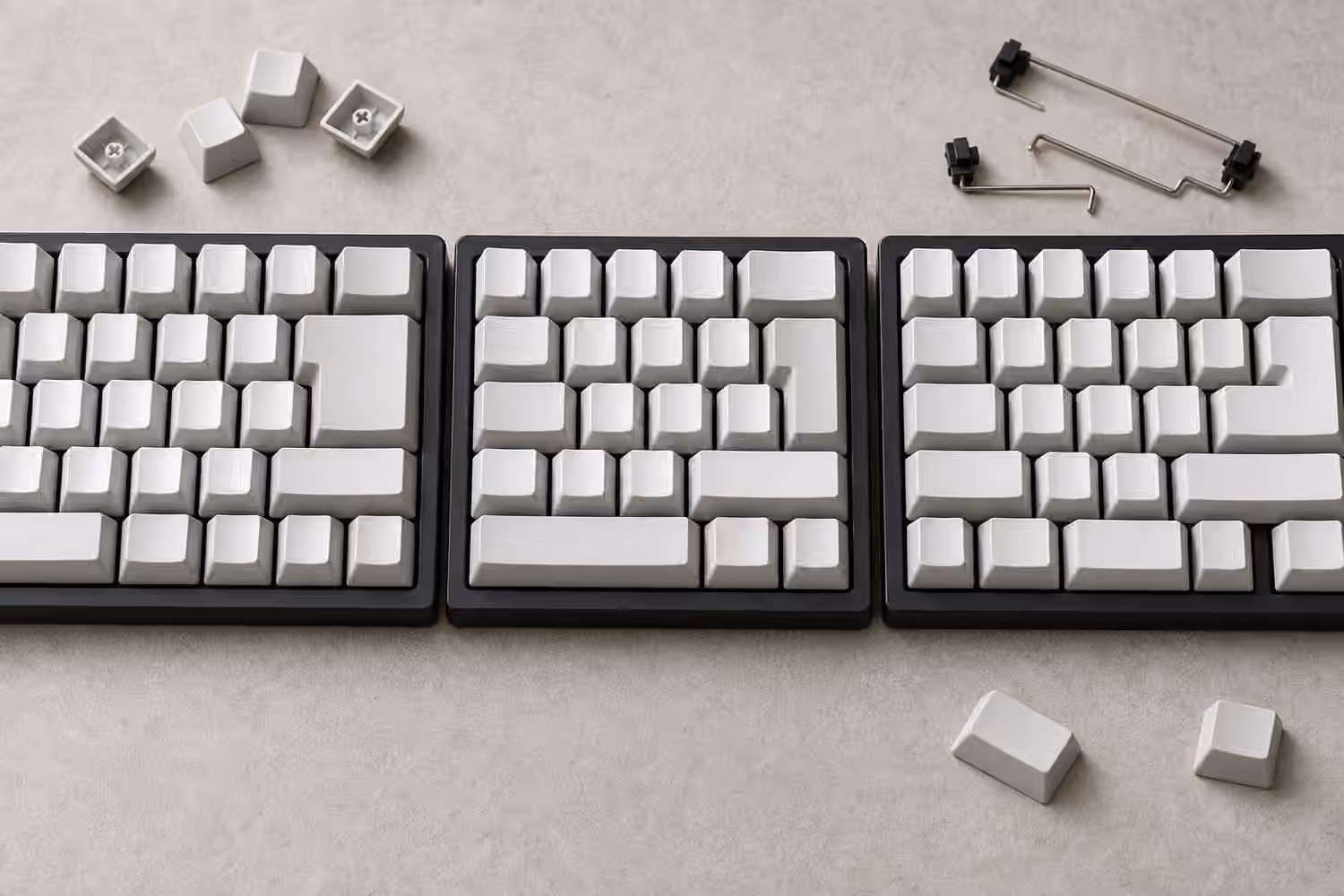 Three compact keyboard layouts with different Enter and Shift key shapes.