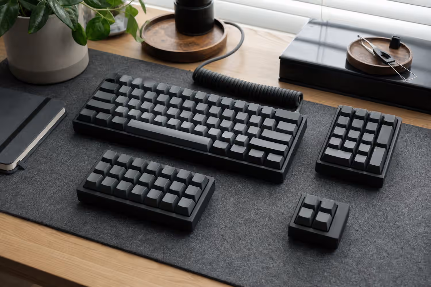 Compact keyboard with separate blank numpad, macropad, and navigation modules.